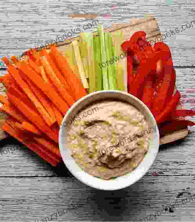 A Plate Of Celery Sticks With A Bowl Of Hummus Sweet And Savory Fat Bombs: Delicious And Healthy Snacks Under 150 Calories