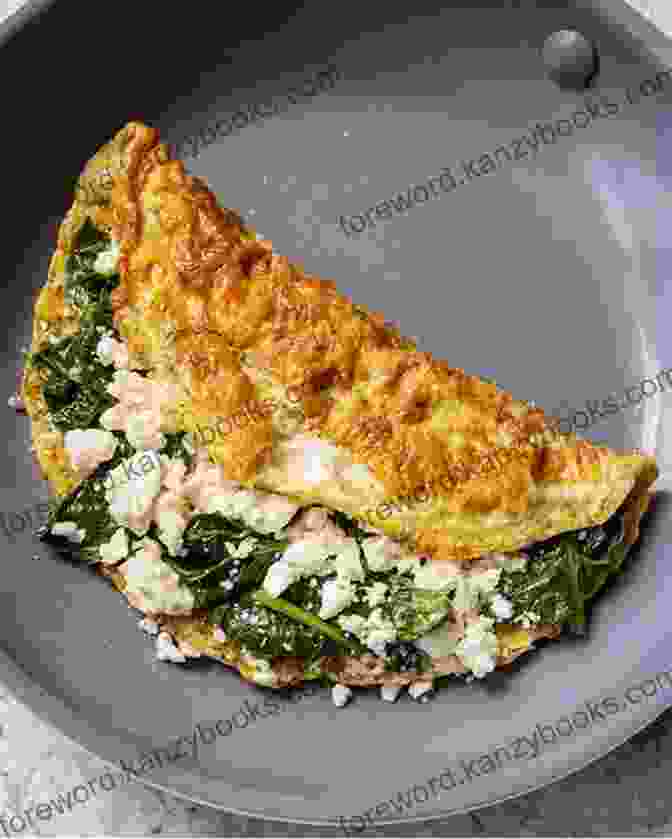 Savory Omelet With Spinach And Feta THE BREAKFAST COOKBOOK: 100 Breakfast And Brunch Easy Recipes To Start The Day In The Best Way A Step By Step Guide With Color Images